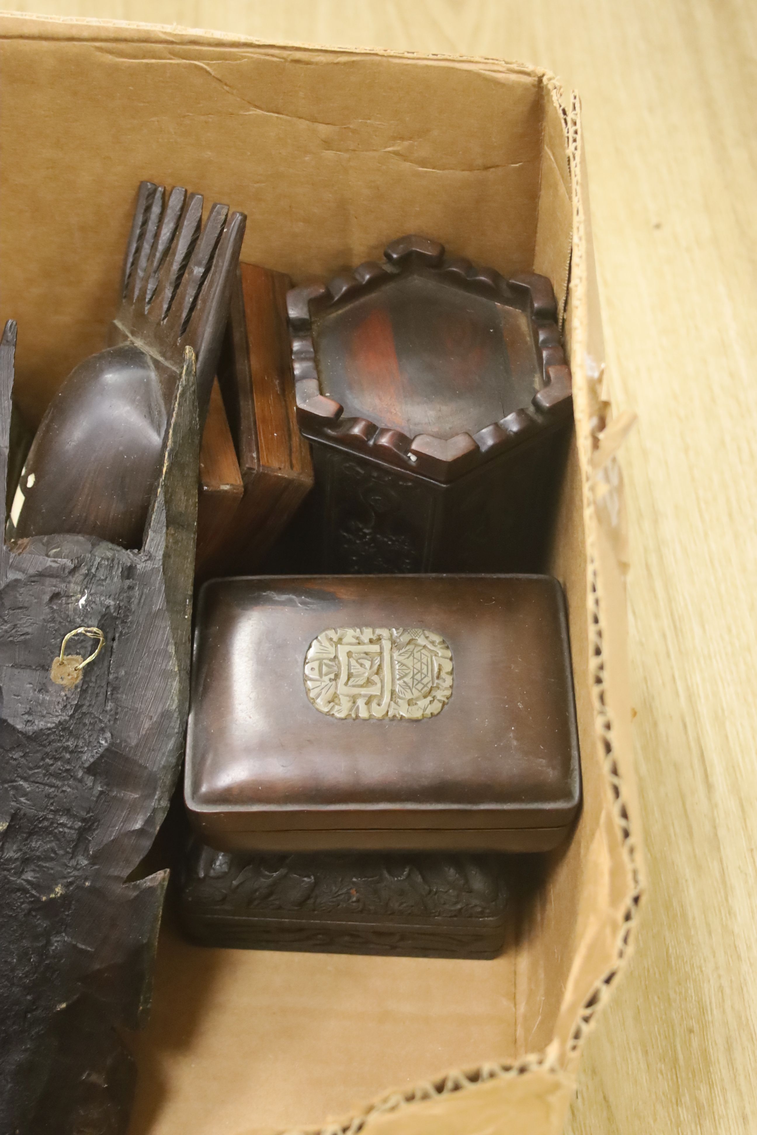 A quantity of Chinese and other carved wood boxes and wood carvings